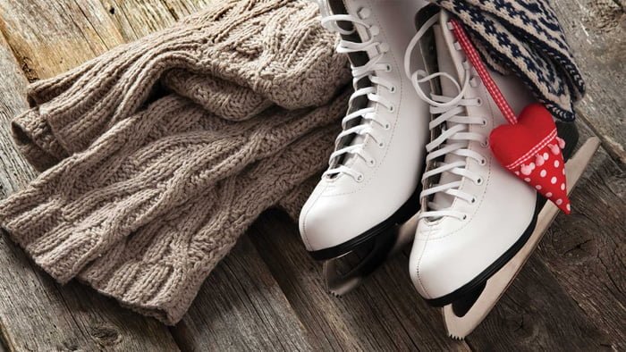 The white ice skates on old wooden boards